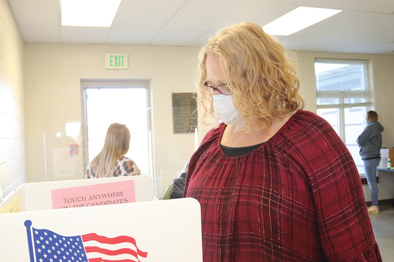 Voter Cindy Sheetz considers local, state and national candidates before casting her vote Tuesday at North Montgomery High School.